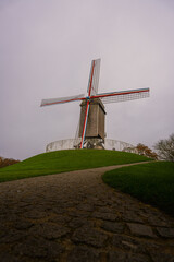 Obraz premium Belgium windmill in Bruges, Belgium. Colourful windmill.