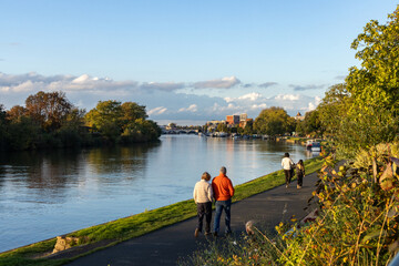 People in Surbiton walking along the River Thames footpath towards Kingston Upon Thames