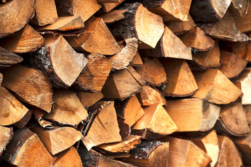 Fototapeta premium pile of firewood as a wooden background