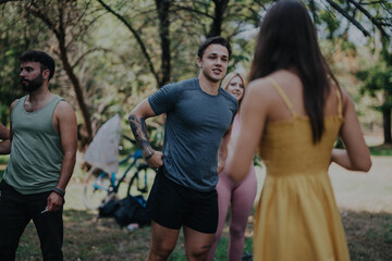 A group of friends enjoying a sunny day at the park, engaging in friendly conversation and relaxation. The setting is casual and lively, conveying friendship and leisure in an outdoor environment.