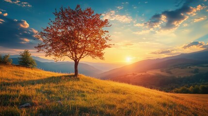Obraz premium Idyllic Sunset Over Serene Mountain Landscape With Solitary Tree And Majestic Sky