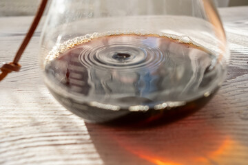 brewing coffee with coffee wooden dripper in close-up	
