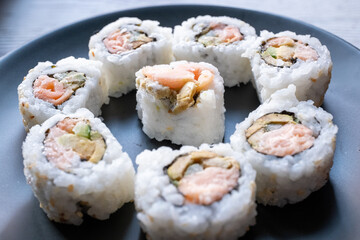 sushi on black plate