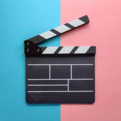 Fototapeta premium Movie gripper. Movie clipboard, isolated on a Soft blue and Pink Pastel