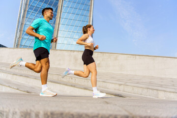 Morning Joggers Enjoy a Brisk Run Along the Modern Architecture in a Vibrant Cityscape on a Sunny...