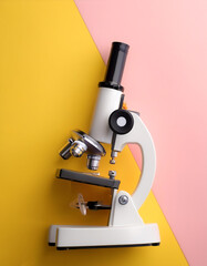 microscope, isolated on a Yellow and Pink Pastel