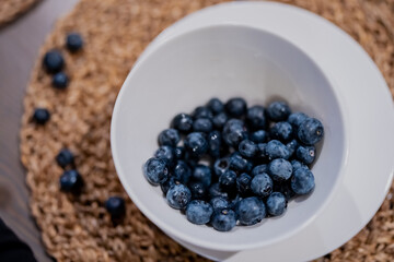 Fresh healthy nice big blueberries inside white modern tray. Tasty early vitamins of berries top view