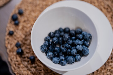 Fresh healthy nice big blueberries inside white modern tray. Tasty early vitamins of berries top view