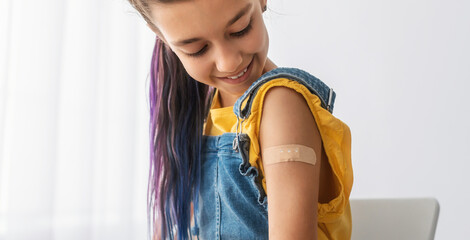 Healthcare And Inoculation Concept. Portrait Of Smiling Teen Patient Showing Vaccinated Arm With Plaster On Shoulder After Coronavirus Vaccination, Looking At Hand. Antiviral Vaccine, Banner, Panorama