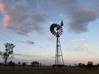 Wind pump turning at sunset outback Australia