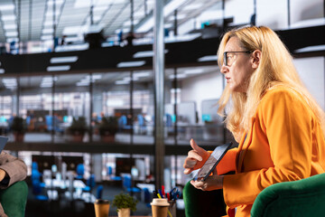 Multicultural group of businesswomen in a high powered meeting, promoting gender equality and female authority in a work environment. Leaders in a male dominated industry, enlightened world