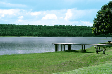 Photograph of a view of the bridge extending into the lakeside.