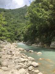 Hiking in Greece with River, Clear Pebble Beach, and Mountain View