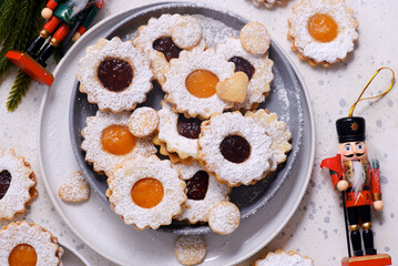 Traditional Christmas Linzer Cookies on a Christmas rustic background