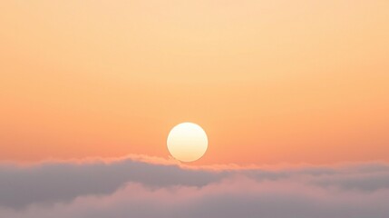 The Orb Of The Sun Behind A Small Cloud In A Clear Orange Sunset Sky