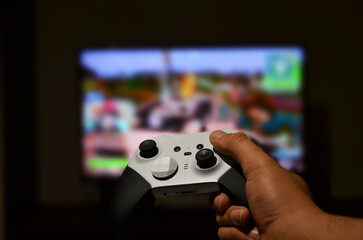 a man likes to play video games on the console