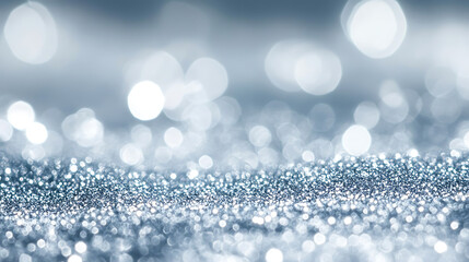 Abstract blue bokeh background with defocused glitter closeup of sparkling metallic pigment dust