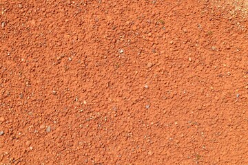 Red ground gravel abstract background