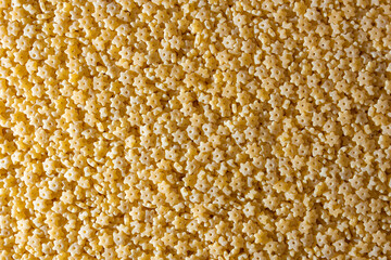 Uncooked Stelline Pasta: A Culinary Canvas of Stelline Macaroni, Creating a Lively and Textured Background for Gourmet Cooking. Dry Pasta. Raw Macaroni - Top View, Flat Lay