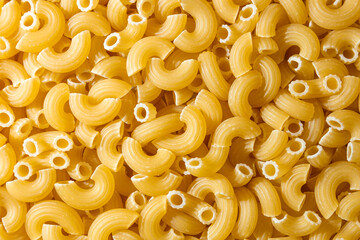 Uncooked Chifferi Rigati Pasta: A Culinary Canvas of Chifferi Rigati, Creating a Lively and Textured Background for Gourmet Cooking. Dry Pasta. Raw Macaroni - Top View, Flat Lay