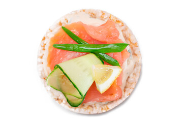 Rice Cake Sandwich with Fresh Salmon, Lemon and Greens - Isolated on White Background. Diet Food. Quick and Healthy Sandwiches. Crispbread with Fresh Fillings. Healthy Dietary Snack