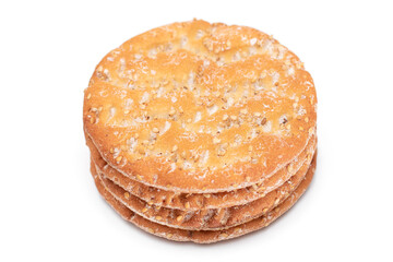 A Stack of Round Salt Crackers with Sesame Isolated on White Background. Dry Snacks - Isolation