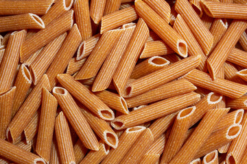 Uncooked Whole Grain Penne Rigate Pasta: A Culinary Canvas of Whole Wheat Macaroni, Creating a...
