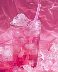 A refreshing pink drink with ice and a straw, set against a vibrant pink background.