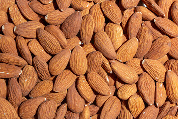 Scattered Almonds. Background from Almond Nuts. Natural High-Calorie Snacks
