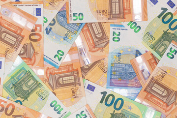Different Euro Banknotes Money Background. Euro Money Currency. Colored Paper Money. A Lot of Fifty Euro Bills. Business, Finances, Cash and Money Saving Concept