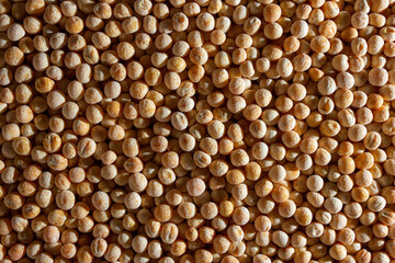 Uncooked Yellow Polished Peas Background. A Culinary Canvas of Dry Yellow Peas, Creating a Lively and Textured Background for Gourmet Cooking. Scattered Raw Polished Peas. Healthy Eating Ingredients