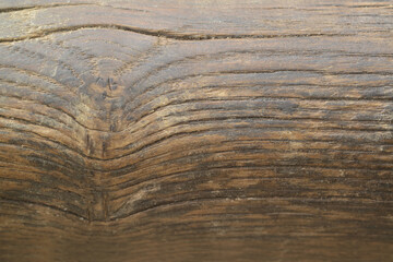 Texture or background of light colored natural wood texture, The surface of the tree trunk is thick with bark cracks. Wall of building.