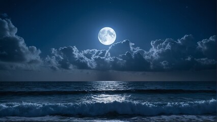 A full moon shines brightly over the ocean, casting a serene glow on the waves and the dark blue sky dotted with white clouds.