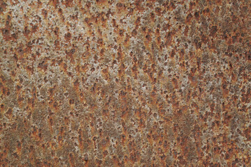 Texture or background of the walls of rusted steel sheets are an orange color, very dark and abstract.