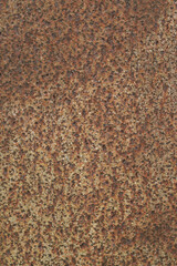 Texture or background of the walls of rusted steel sheets are an orange color, very dark and abstract.