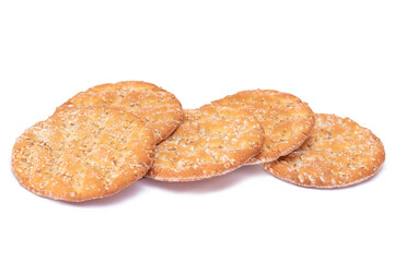 A Heap of Round Salt Crackers with Sesame Isolated on White Background. Dry Snacks - Isolation
