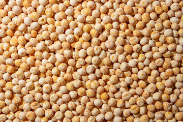 Uncooked Yellow Polished Peas Background. A Culinary Canvas of Dry Yellow Peas, Creating a Lively and Textured Background for Gourmet Cooking. Scattered Raw Polished Peas. Healthy Eating Ingredients