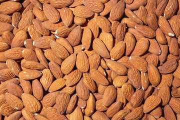 Scattered Almonds. Background from Almond Nuts. Natural High-Calorie Snacks