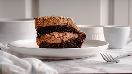 Chocolate Cake Slice on White Plate – Selective Focus

