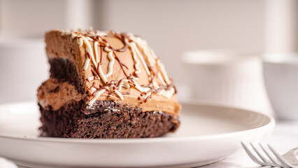 Chocolate Cake Slice on White Plate – Selective Focus

