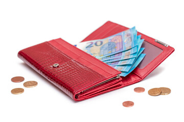 Opened Red Women Purse with 20 Euro Banknotes Inside and Scattered Euro Cent Coins - Isolated on White Background. A Wallet Full of Money Symbolizing Wealth, Success, Shopping and Social Status -