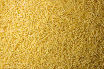 Uncooked Filini Pasta: A Culinary Canvas of Noodles, Creating a Lively and Textured Background for Gourmet Cooking. Dry Pasta. Raw Macaroni - Top View, Flat Lay