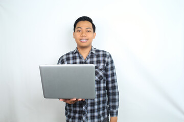 smiling asian man using laptop isolated on white background wearing plaid shirt