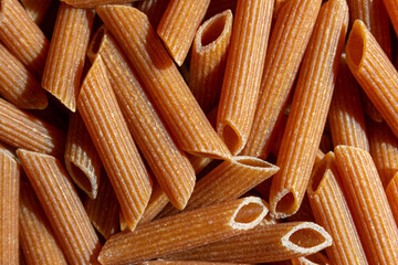 Uncooked Whole Grain Penne Rigate Pasta: A Culinary Canvas of Whole Wheat Macaroni, Creating a...