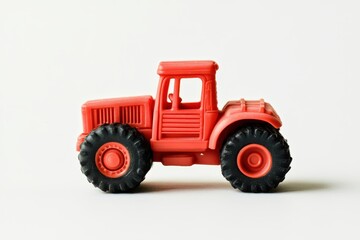 White background with red toy tractor