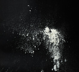 White snow falling down on black background
