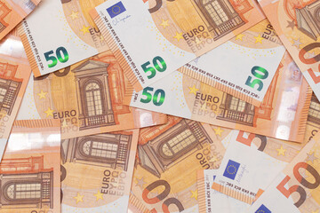 50 Euro Banknotes Money Background. Euro Money Currency. Orange Paper Money. A Lot of Fifty Euro Bills. Business, Finances, Cash and Money Saving Concept