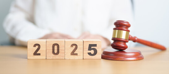 Happy New Year 2025 with judge gavel on table. Law, lawyer, judgment, justice auction and bidding...