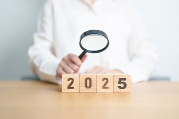 Happy New Year 2025 with magnifying glass and people. hiring, employee, recruitment, job, SEO and jobless concept