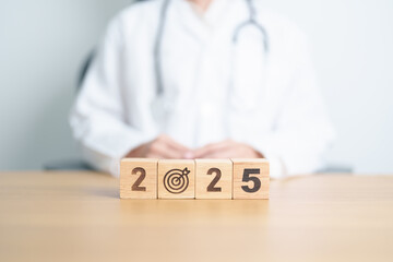 2025 year block with dartboard icon again doctor. Goal, Target, Resolution, strategy, plan, Action, mission, motivation, Health, Healthcare, medical and wellness concept